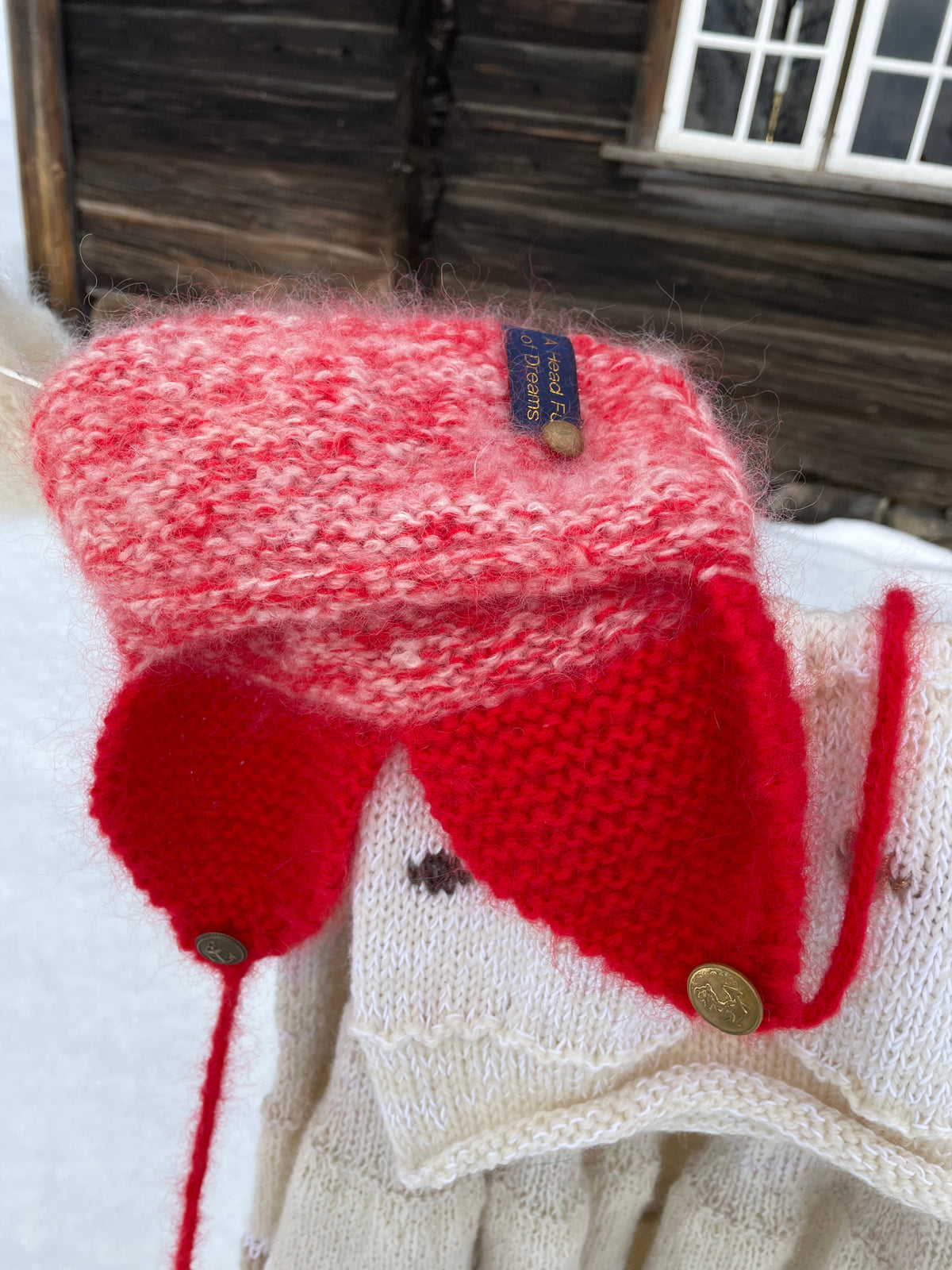 Warm hat with ear flaps and pompoms in red and white – The Arctic Cap from CosyMonday