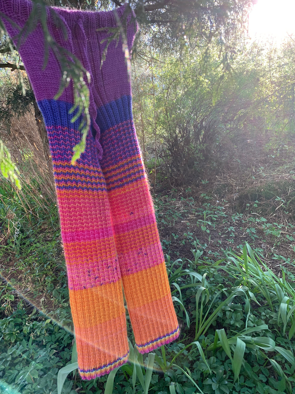 Purple, blue, pink, yellow and orange striped wool trousers