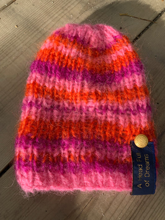 Hand-knitted striped rib hat in orange and pink mohair with a slouch at the back – Striped Pink from CosyMonday
